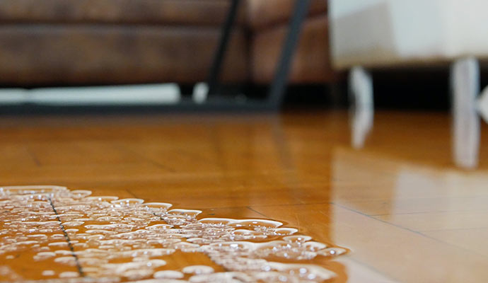 water damaged wooden tile floor