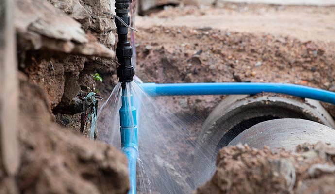 water pipe break exposing a burst water pipe spraying water